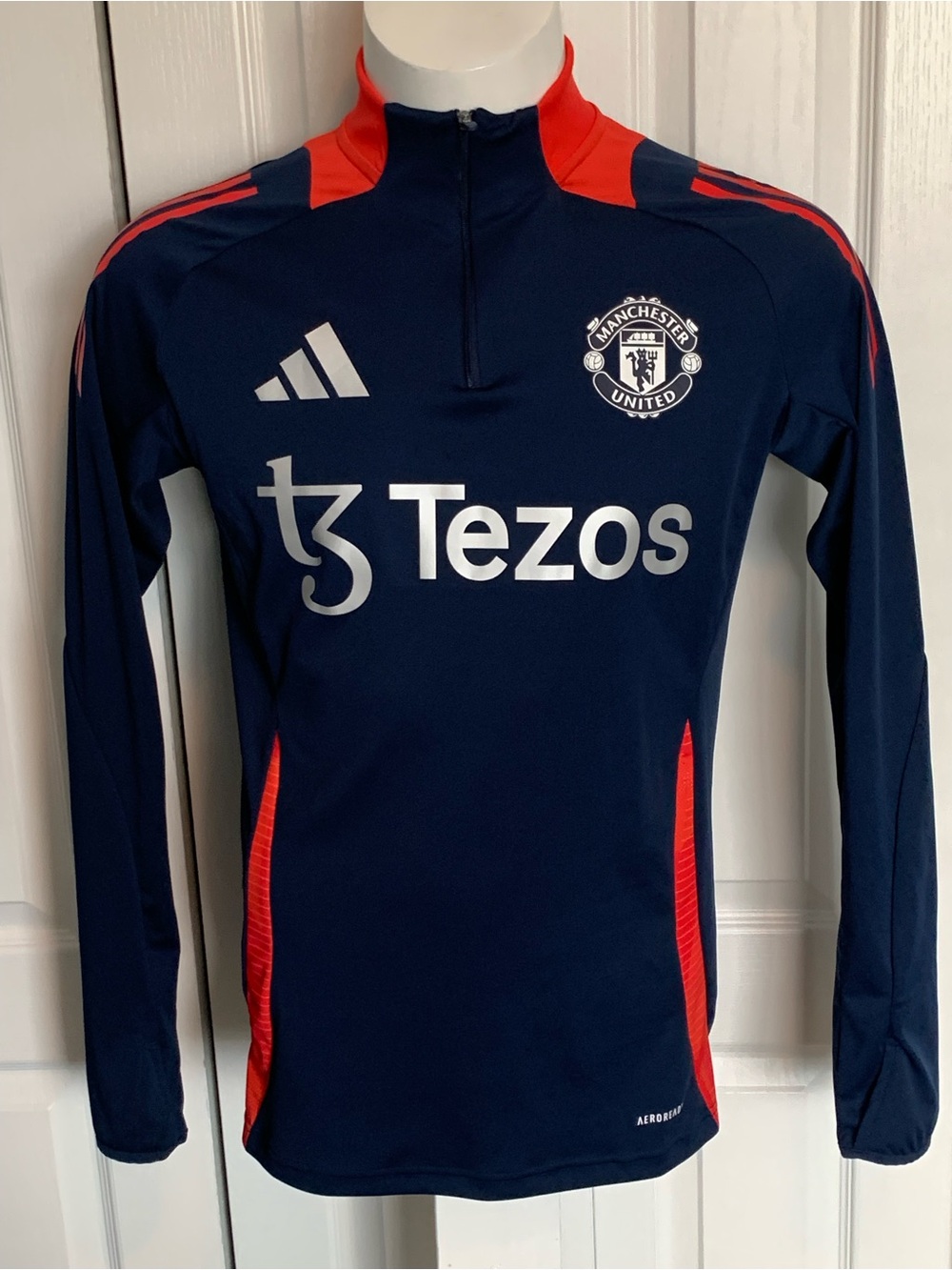Adidas 2024/25 Manchester United Tiro training top in navy.